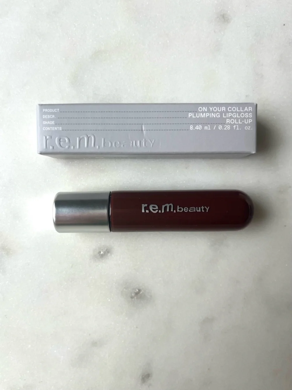 r.e.m. beauty by Ariana Grande, On Your Collar Plumping Lip Gloss “Rollup” Shade